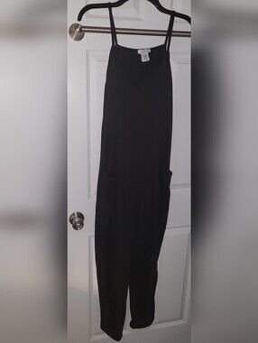Sleek Black Spaghetti-Strap Jumpsuit with Side Pockets